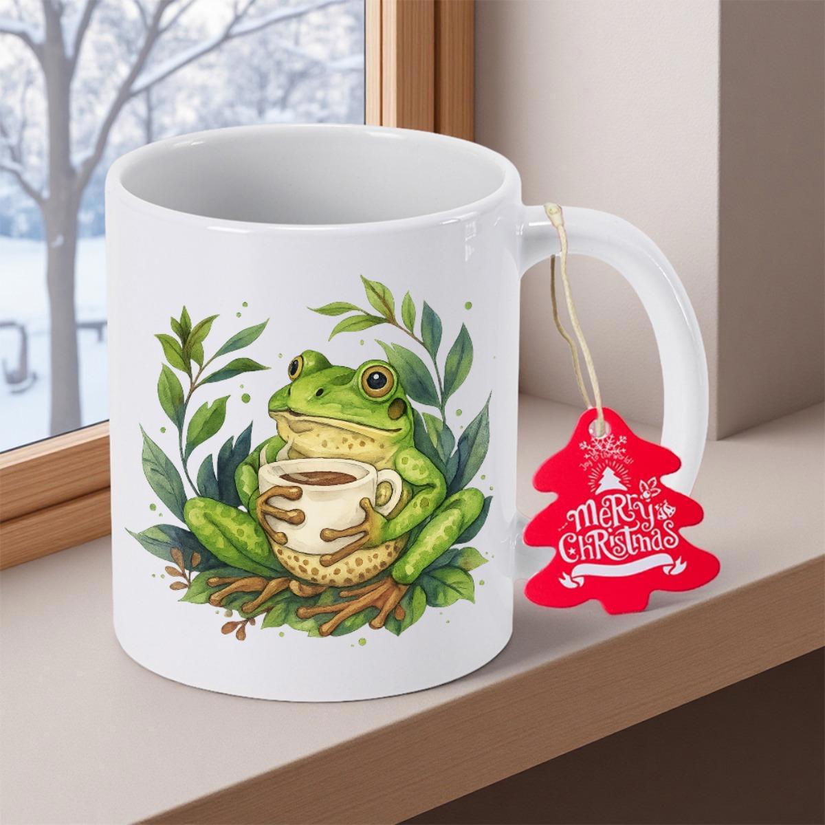 Tailorly White Ceramic 11 oz Mug - Merry Christmas Cute Green Frog Holding Warm Coffee Cup Among Lush Green Leaves Frog