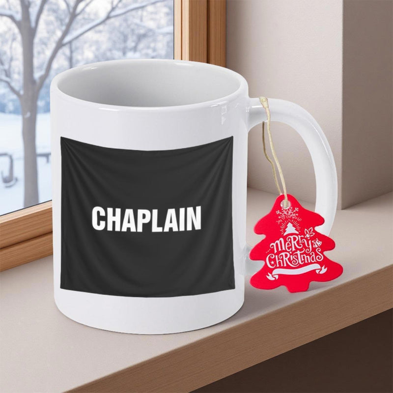 Tailorly White Ceramic 11 oz Mug - Chaplain Merry Christmas Bold White Text On Black Banner With Red Tree Tag Hanging On Handle Mug