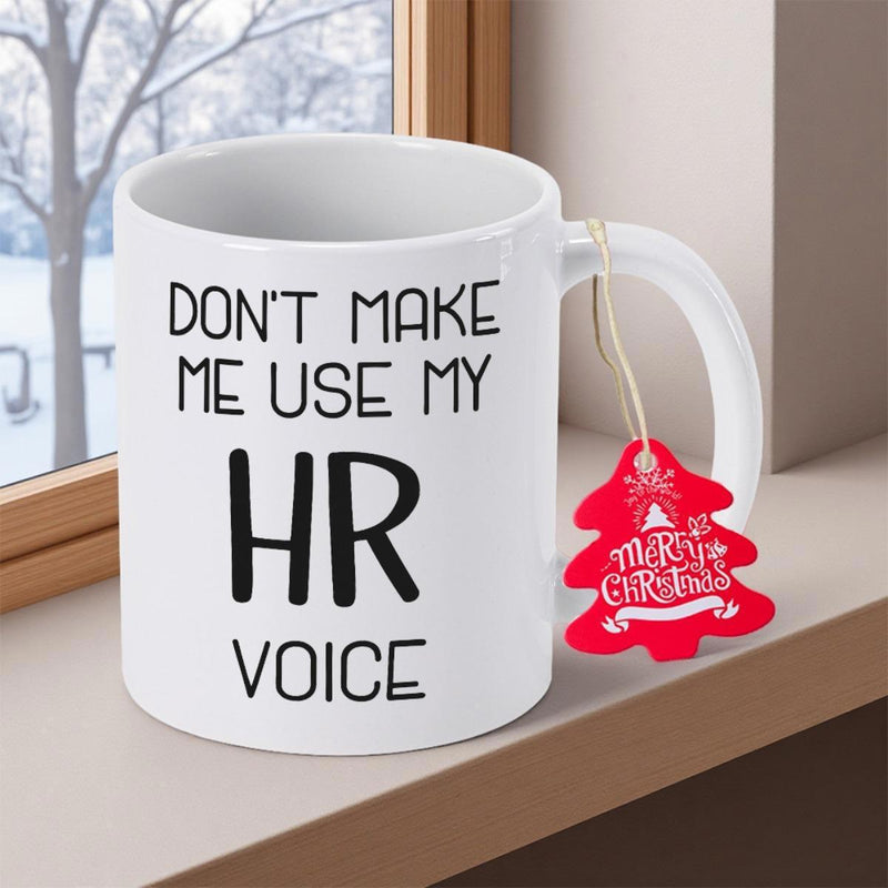Tailorly White Ceramic 11 oz Mug - Don't Make Me Use My HR Voice Sleek Resting On Wooden Ledge Beside Winter Window Mug