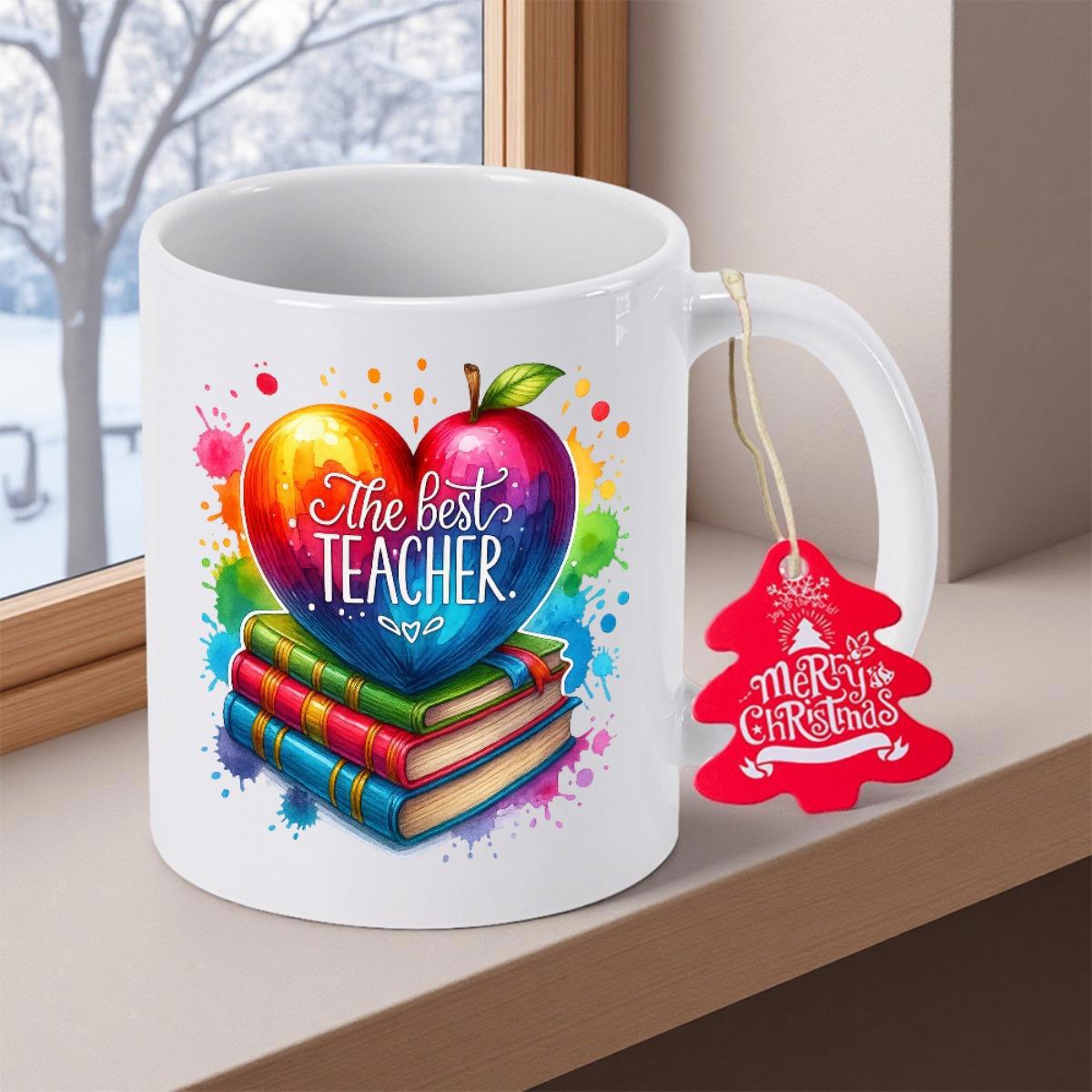 Tailorly White Ceramic 11 oz Mug - The Best Teacher Merry Christmas Vibrant Rainbow Heart Shape Resting On Stacked Colorful Books Apple
