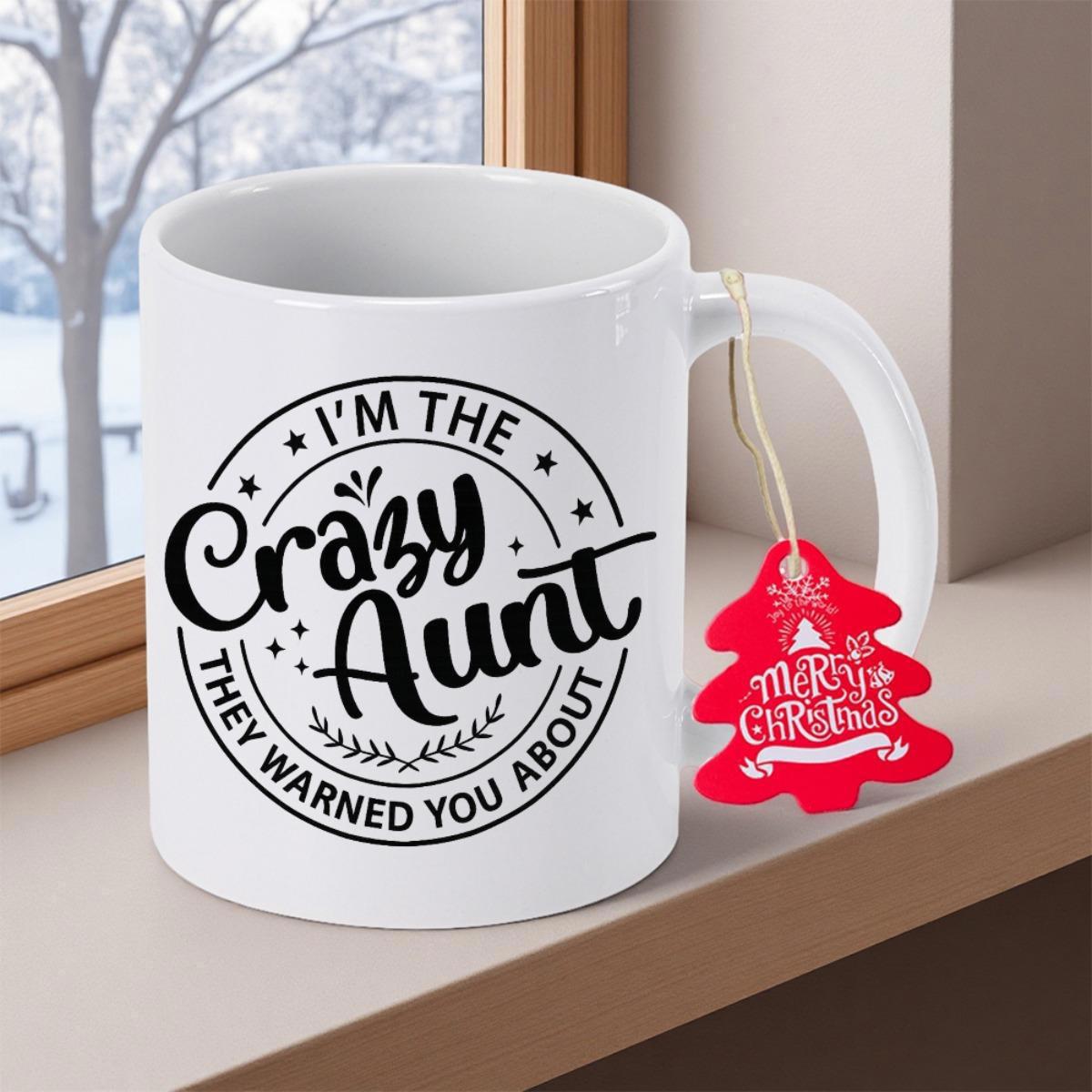 Tailorly White Ceramic 11 oz Mug - Im The Crazy Aunt They Warned You About Merry Christmas Classic White Ceramic Cup With Circular Slogan Design Sitting On