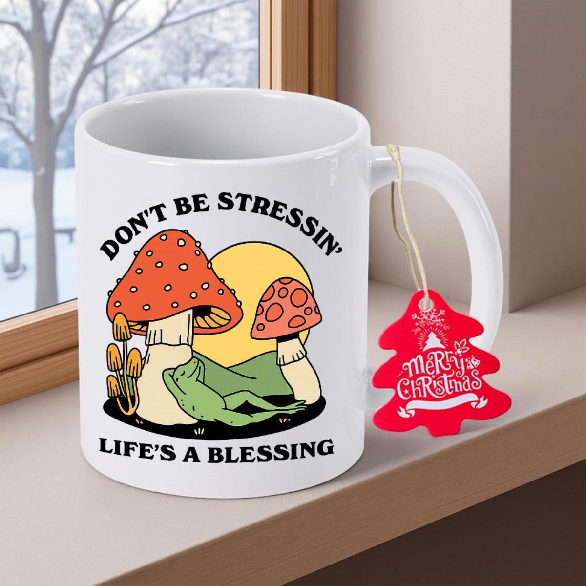 Tailorly White Ceramic 11 oz Mug - Don't Be Stressin Life's A Blessing Relaxed Green Frog Resting Under Red Spotted Cap In Golden Sun Mushroom