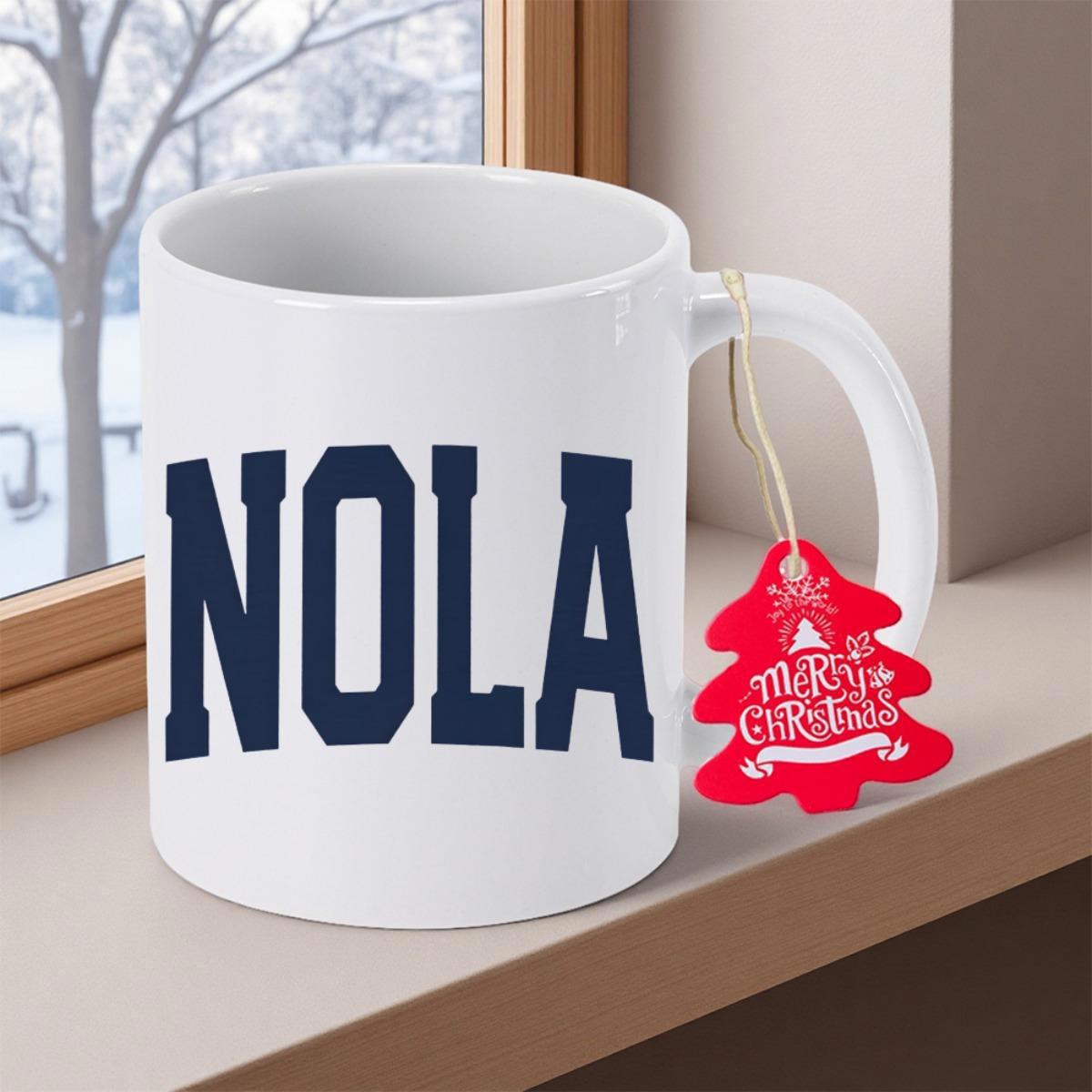 Tailorly White Ceramic 11 oz Mug - NOLA Merry Christmas Festive Red Tree Tag Beside Bold Block Text On