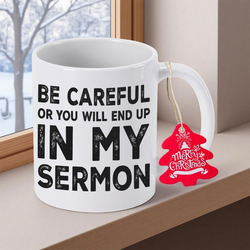 Tailorly White Ceramic 11 oz Mug - Be Careful Or You Will End Up In My Sermon Merry Christmas Minimalist White Ceramic Body Sitting On Rustic Wooden Surface Window