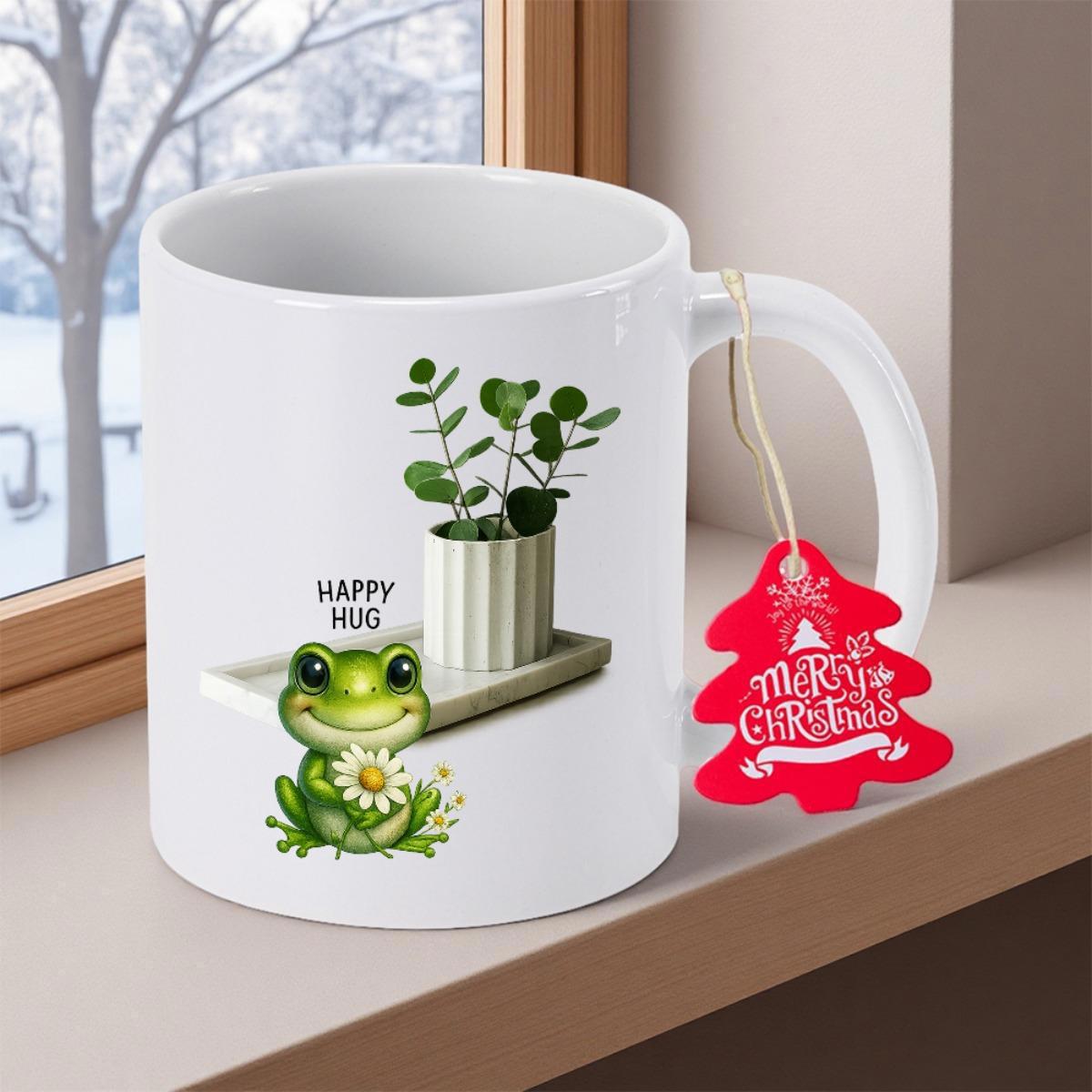 Tailorly White Ceramic 11 oz Mug - Happy Hug Cute Green Frog Holding Small Daisy Near Potted Leafy Plant Frog