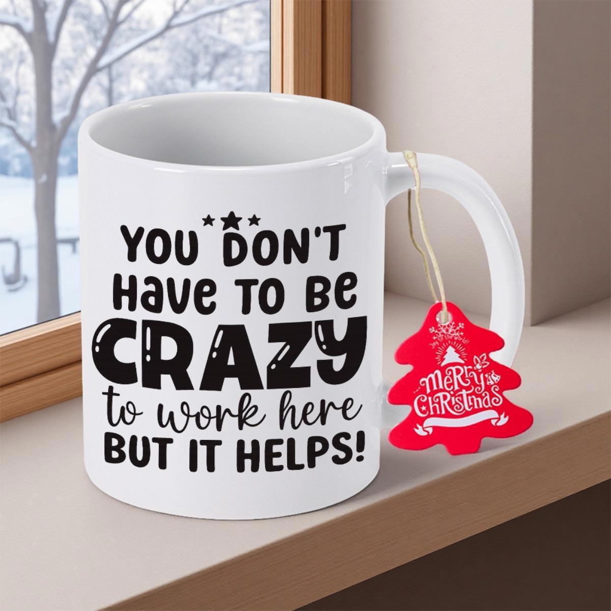 Tailorly White Ceramic 11 oz Mug - You Don't Have To Be Crazy To Work Here But It Helps Elegant Minimalist Ceramic Vessel With Red Festive Tree Tag Mug