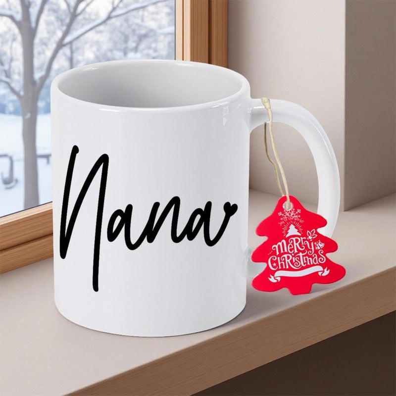 Tailorly White Ceramic 11 oz Mug - Nana Merry Christmas Placed On Windowsill Near Snowy Winter Scene Mug