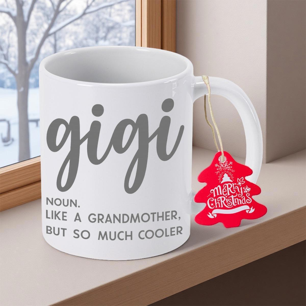 Tailorly White Ceramic 11 oz Mug - Gigi Noun Like A Grandmother But So Much Cooler Merry Christmas Minimalist White Ceramic Vessel Resting On A Wooden Ledge Near