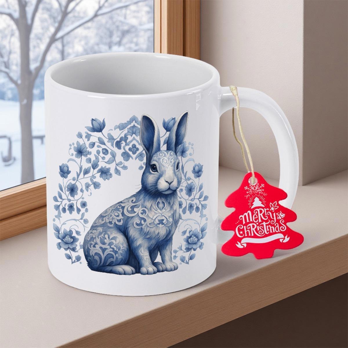 Tailorly White Ceramic 11 oz Mug - Merry Christmas Blue Floral Ornamental Design With Delicate Petals Surrounding A Graceful Patterned Rabbit