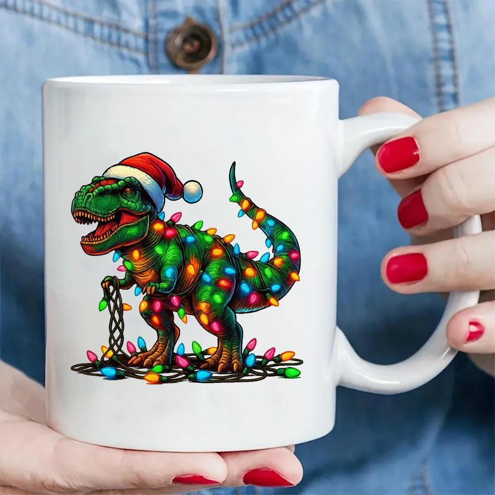 Tailorly White Ceramic 11 oz Mug - Festive Green Dinosaur Wrapped In Glowing Colorful Christmas Lights Wearing Santa Hat Dinosaur