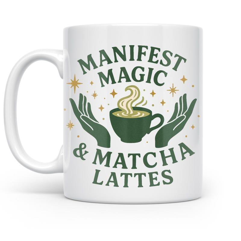 Tailorly White Ceramic 11 oz Mug - Manifest Magic Matcha Lattes Mystical Hands Holding Steaming Green Cup Under Glowing Golden Sparkling Stars Cup