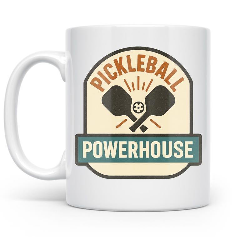 Tailorly White Ceramic 11 oz Mug - Pickleball Powerhouse Retro Badge Design With Two Crossed Paddles And A Circular Ball Pickleball