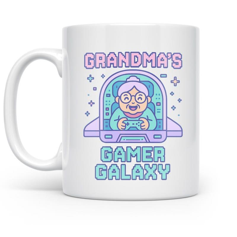 Tailorly White Ceramic 11 oz Mug - Grandmas Gamer Galaxy Smiling Elderly Woman Holding Video Game Controller Inside Futuristic Starry Spacecraft Grandma