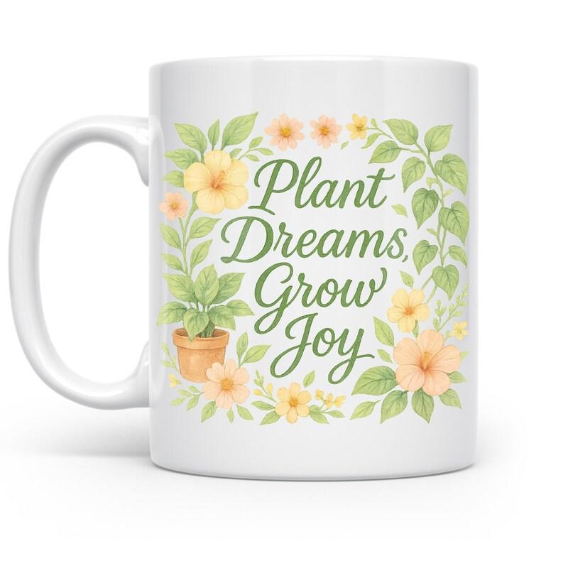 Tailorly White Ceramic 11 oz Mug - Plant Dreams Grow Joy Delicate Flowers Among Lush Green Leaves Surrounding A Small Potted Plant