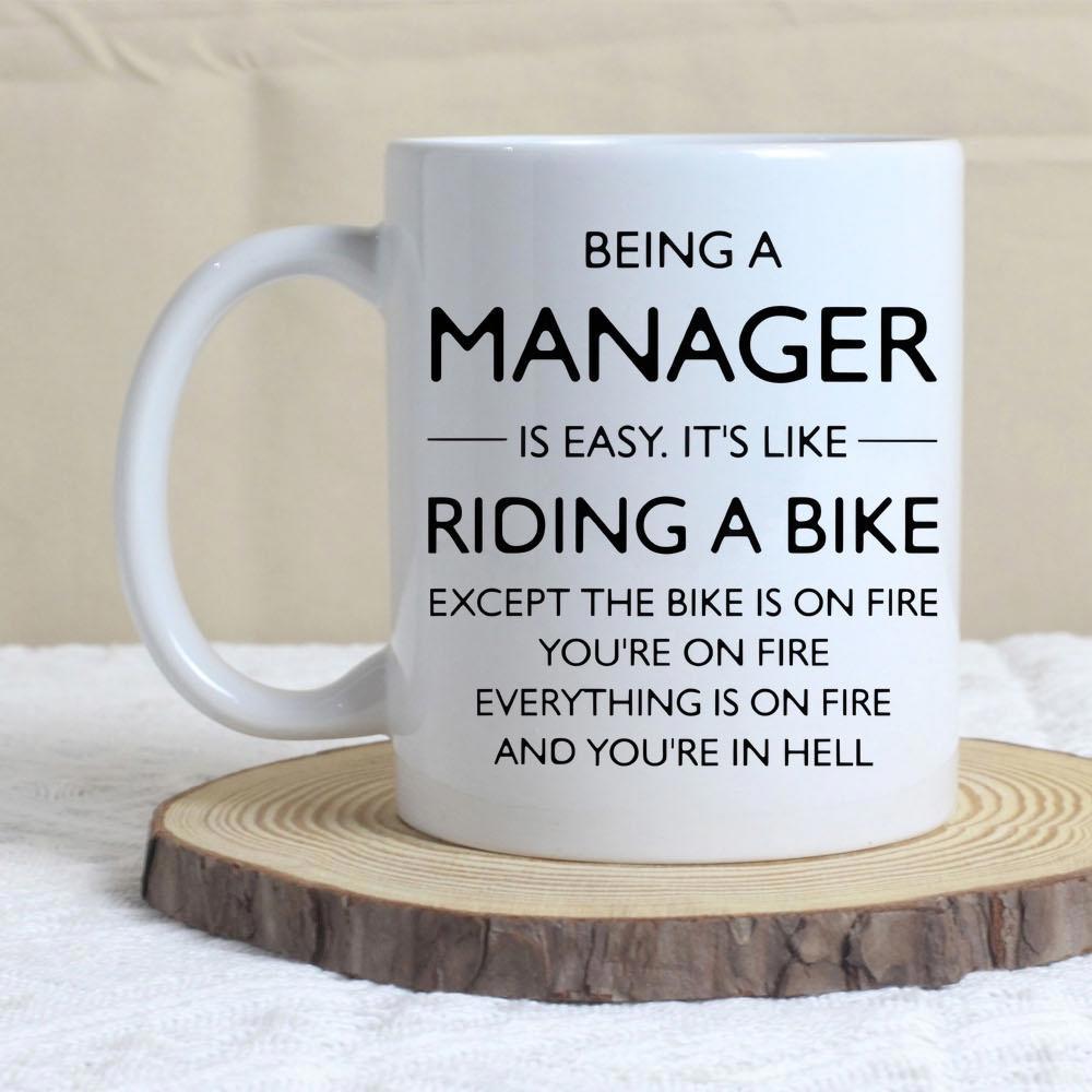 Tailorly White Ceramic 11 oz Mug - Being A Manager Is Easy Its Like Riding A Bike Except The Bike Is On Fire Youre On Fire Everything Is On Fire And Youre In Hell