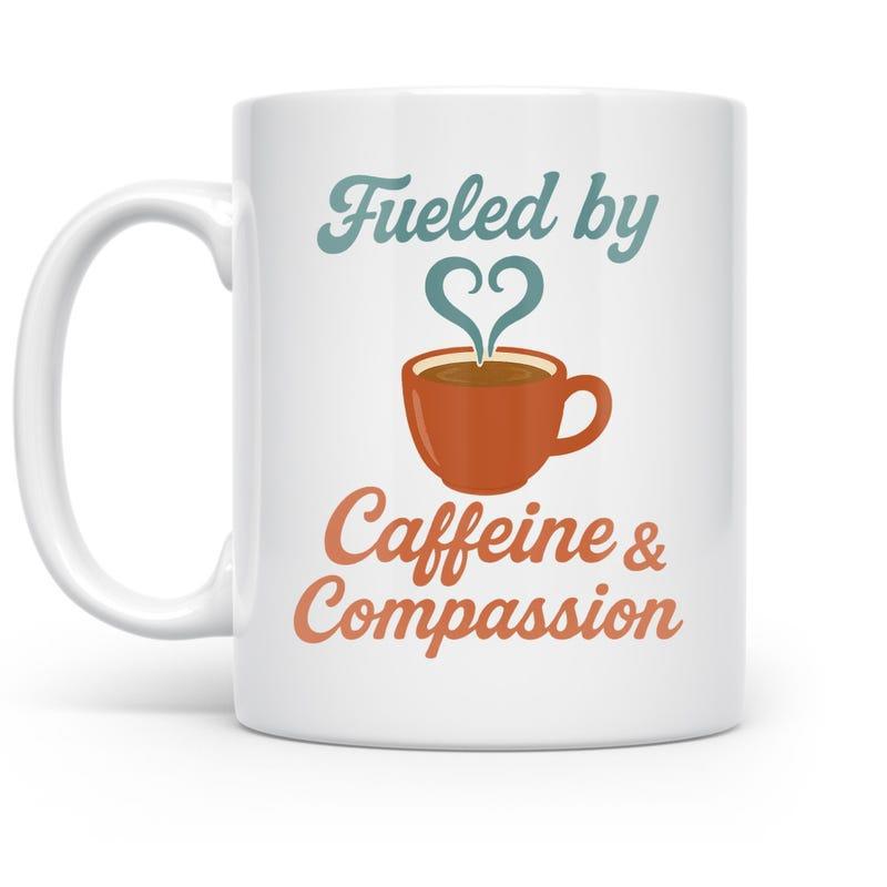 Tailorly White Ceramic 11 oz Mug - Fueled By Caffeine Compassion Steaming Cup Of Hot Brown Liquid With Heart Shaped Vapor Mug