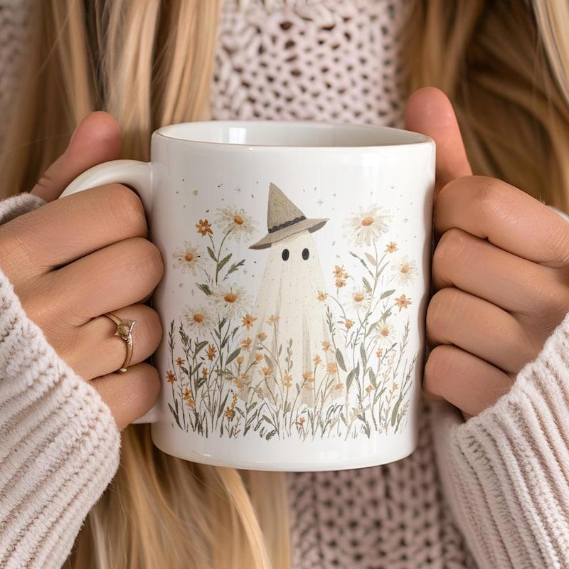 Tailorly White Ceramic 11 oz Mug - Small Ghost Wearing Pointed Witch Hat Among Blooming Wild Daisy Flowers Ghost