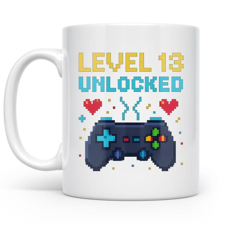 Tailorly White Ceramic 11 oz Mug - Level 13 Unlocked Retro Pixelated Game Pad With Vibrant Hearts And Colorful Confetti Controller