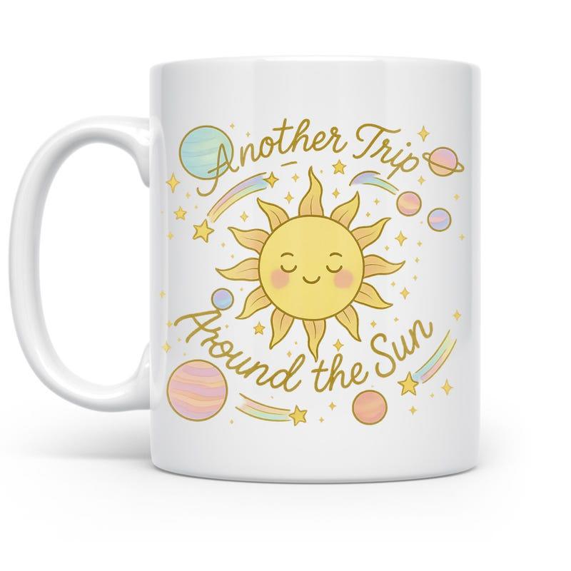 Tailorly White Ceramic 11 oz Mug - Another Trip Around The Sun Smiling Character Among Pastel Planets And Twinkling Shooting Stars Sun