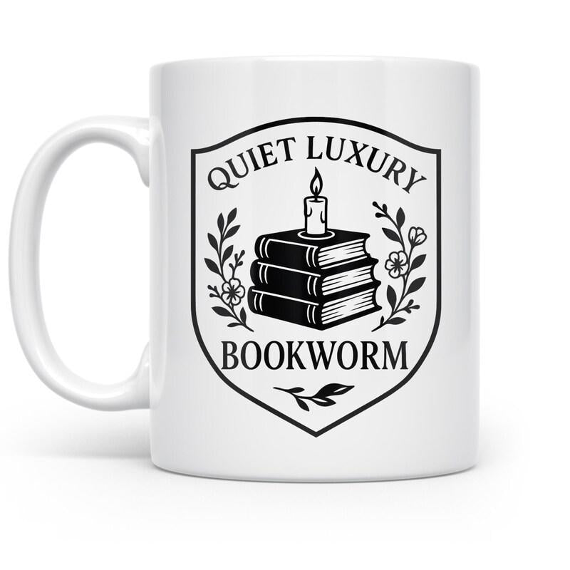 Tailorly White Ceramic 11 oz Mug - Quiet Luxury Bookworm Stack Of Vintage Books With Lit Candle Inside Floral Crest