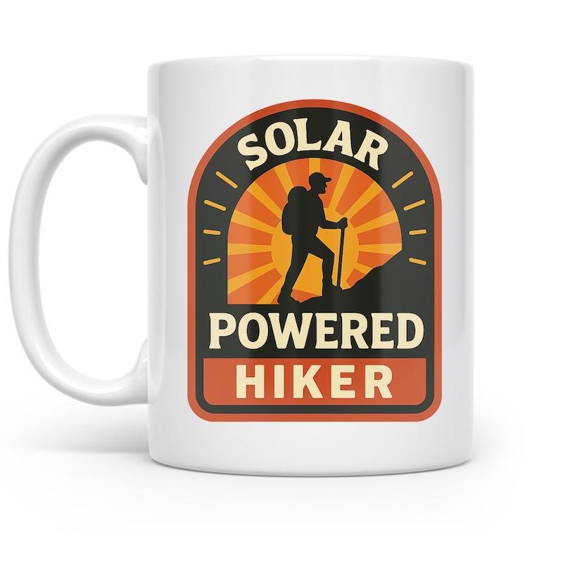 Tailorly White Ceramic 11 oz Mug - Solar Powered Hiker Silhouette Of A Person Trekking Uphill Against A Radiant Sunburst Hiker