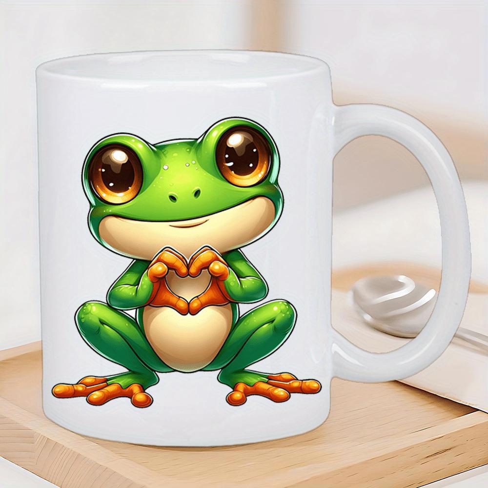 Tailorly White Ceramic 11 oz Mug - Adorable Little Green Cartoon Character With Big Eyes Making Heart Gesture Frog