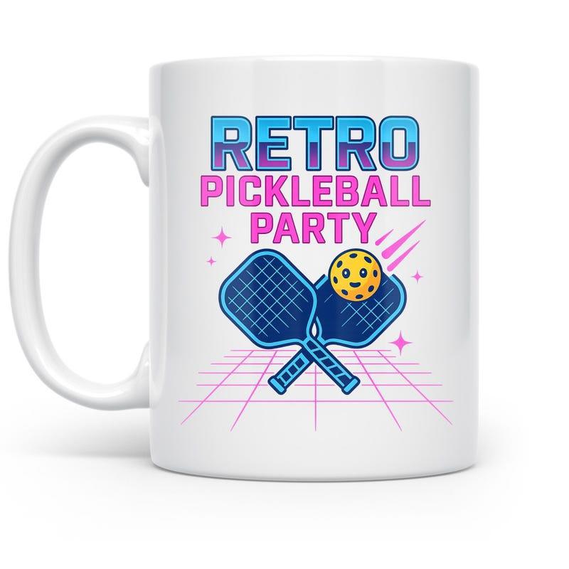 Tailorly White Ceramic 11 oz Mug - Retro Pickleball Party Vibrant Crossed Paddles And Glowing Ball Over A Synthwave Grid Pickleball