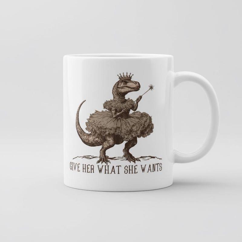 Tailorly White Ceramic 11 oz Mug - Give Her What She Wants Whimsical Brown Tyrannosaurus Rex Wearing Tutu And Crown Holding Magic Wand Dinosaur