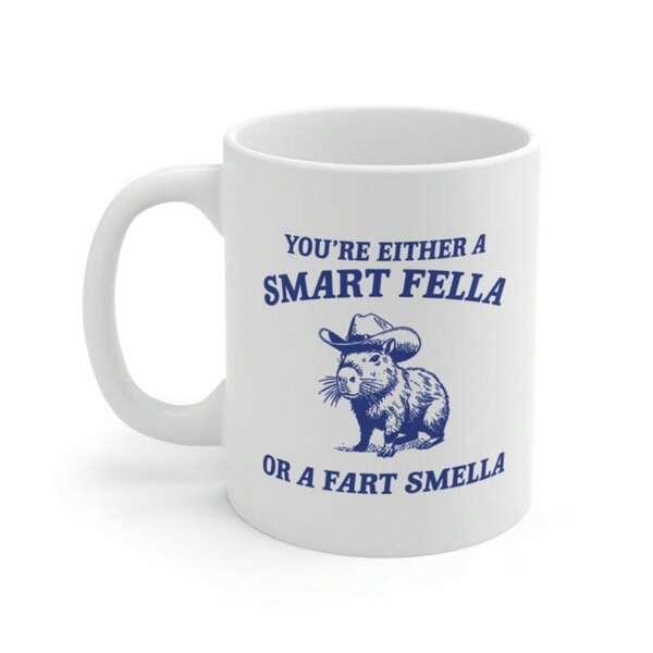 Tailorly White Ceramic 11 oz Mug - Youre Either A Smart Fella Or A Fart Smella Hand Drawn Illustration Featuring A Capybara Wearing A Tiny Cowboy Hat Capybara