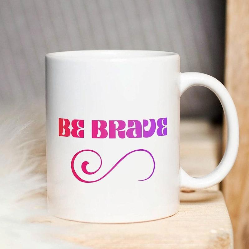 Tailorly White Ceramic 11 oz Mug - Be Brave Pink And Purple Gradient Stylized Swirl Beneath Motivational Text Mug