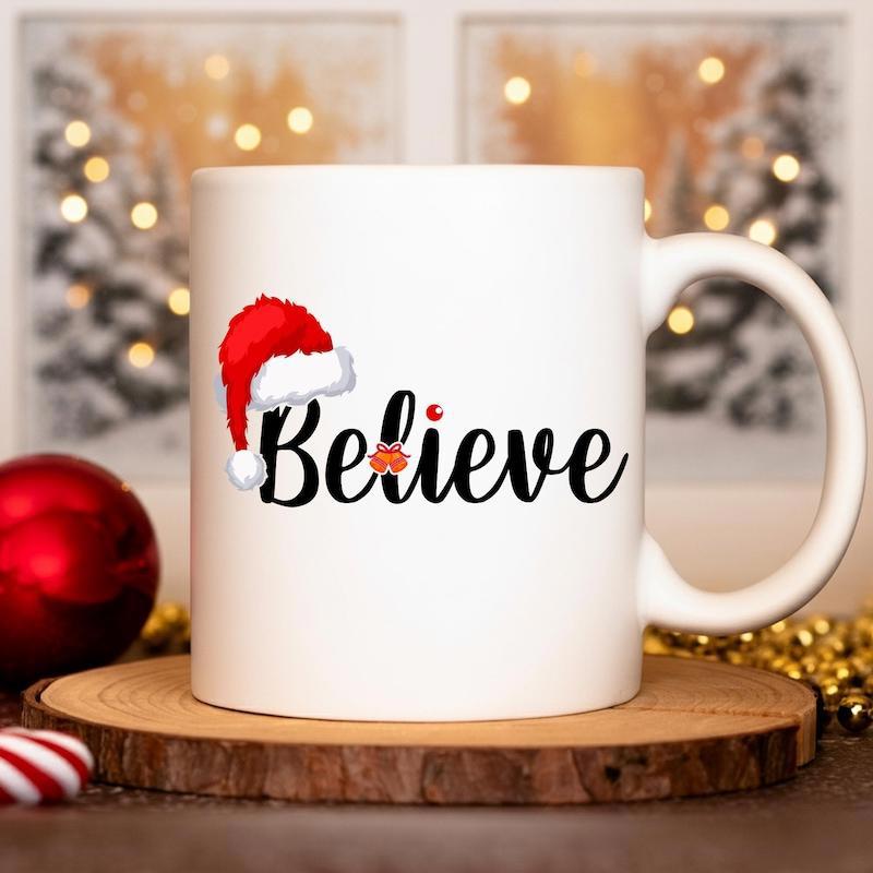 Tailorly White Ceramic 11 oz Mug - Believe Festive Red Santa Hat Resting On Elegant Script Calligraphy Style Believe