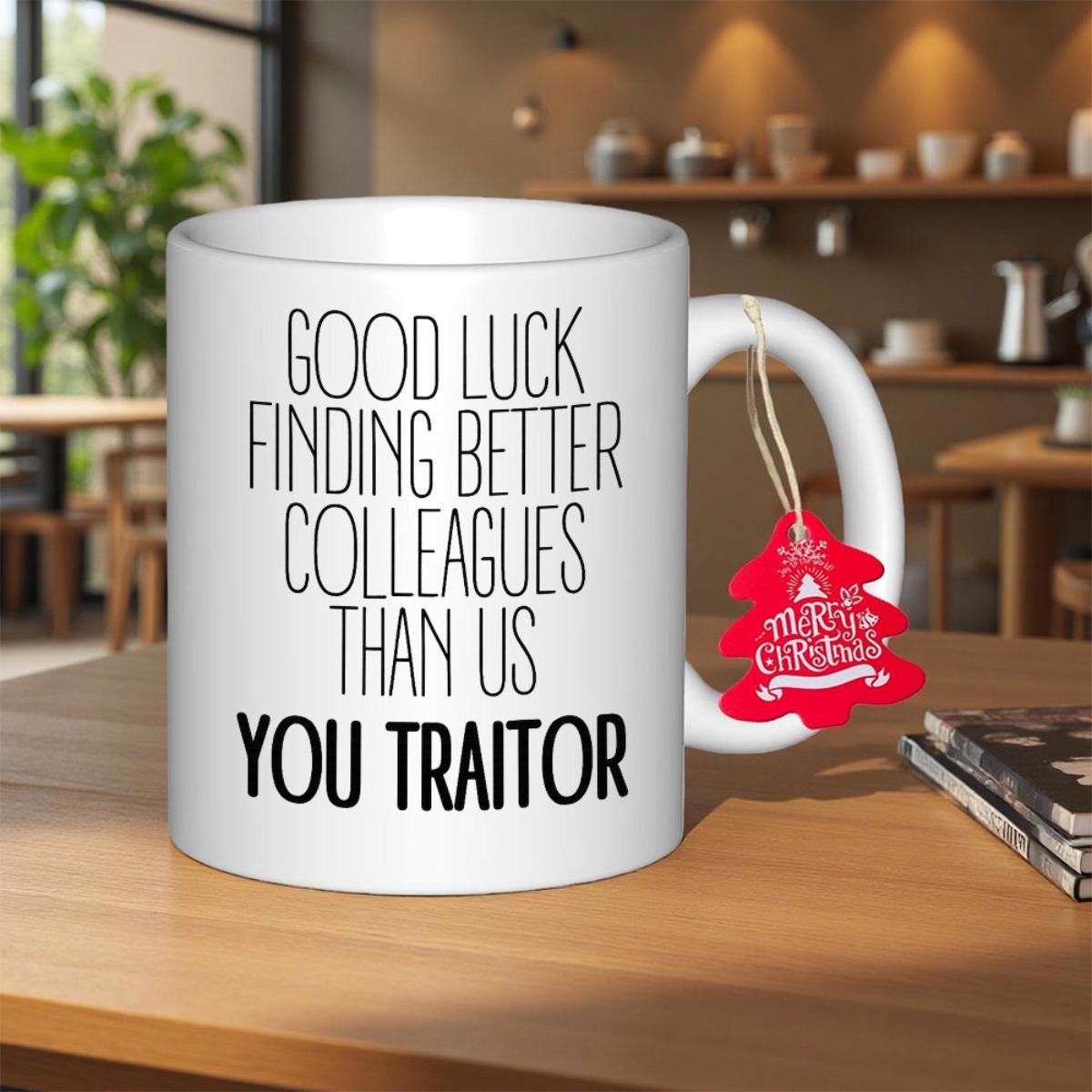 Tailorly White Ceramic 11 oz Mug - Good Luck Finding Better Colleagues Than Us You Traitor Sleek Standing On Wooden Table With Red Tag Mug