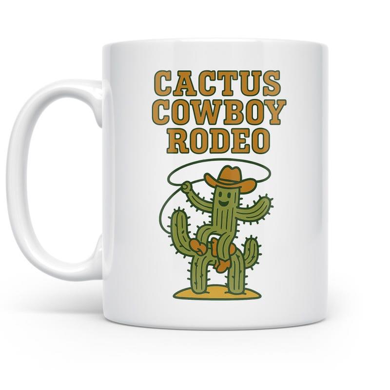 Tailorly White Ceramic 11 oz Mug - Cactus Cowboy Rodeo Whimsical Cartoon Character Riding Desert Plant With Lasso And Hat Cactus