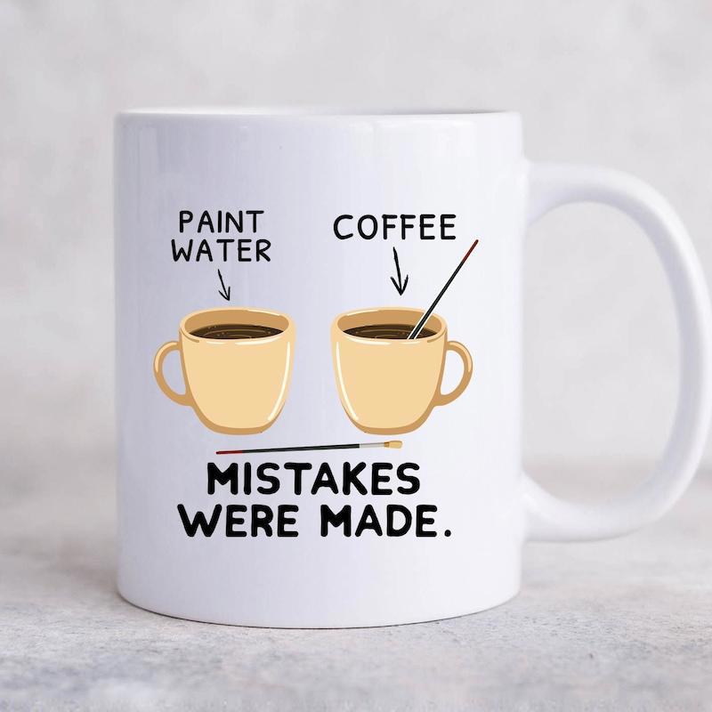 Tailorly White Ceramic 11 oz Mug - Paint Water Coffee Mistakes Were Made Two Ceramic Cups Holding Brushes And Coffee For Artist Humor Mug
