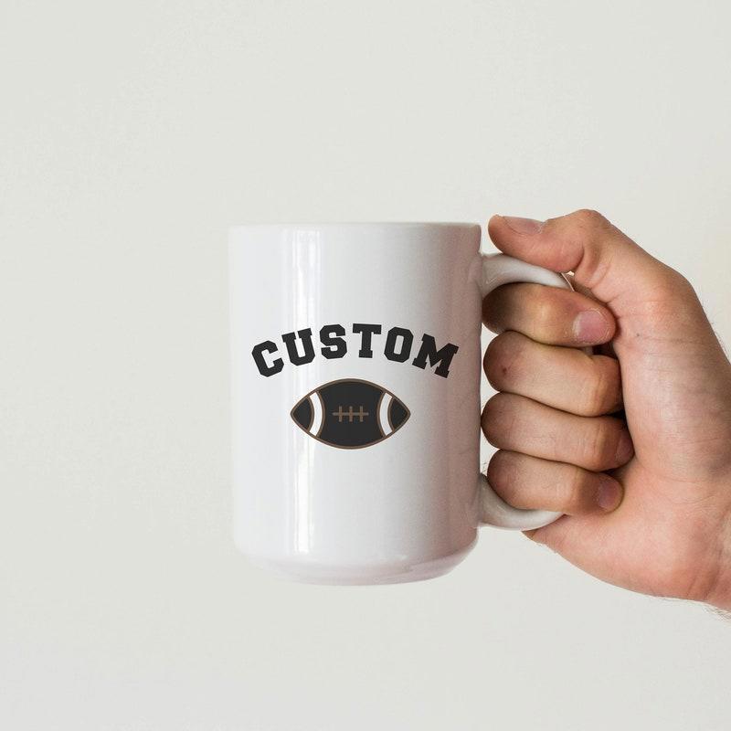Tailorly White Ceramic 11 oz Mug - Custom Classic Athletic Style Featuring A Dark Football With White Stripes Football