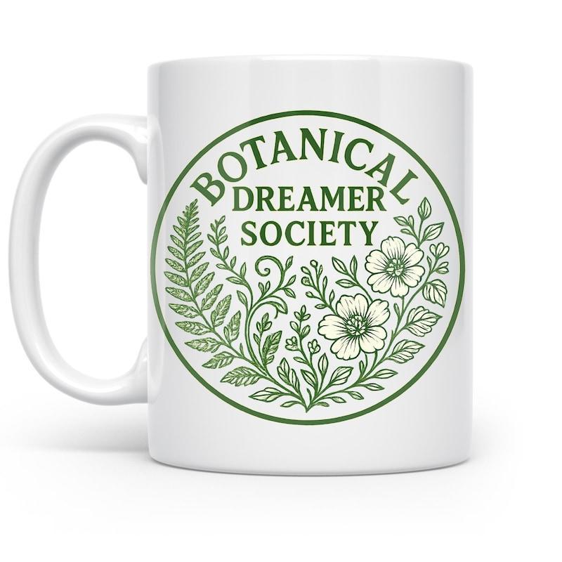 Tailorly White Ceramic 11 oz Mug - Botanical Dreamer Society Intricate Hand Drawn Wildflower And Fern Illustrations Inside A Circular Emblem