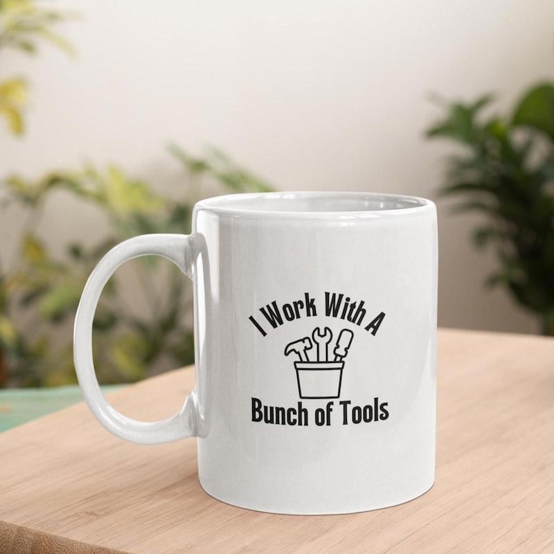 Tailorly White Ceramic 11 oz Mug - I Work With A Bunch Of Tools Minimalist Hand Tools Resting Inside A Simple Container Graphic Tools
