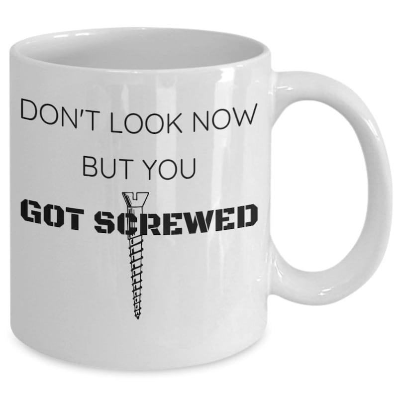 Tailorly White Ceramic 11 oz Mug - Dont Look Now But You Got Screwed Vertical Metallic Fastener Placed Central Between Bold Stencil Style Lettering Hardware Screw