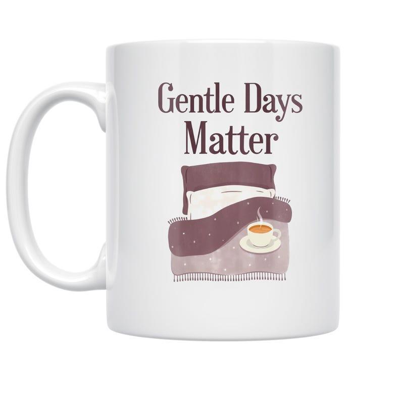 Tailorly White Ceramic 11 oz Mug - Gentle Days Matter Cozy Pillows And Warm Blanket With Steaming Cup Of Coffee Bed