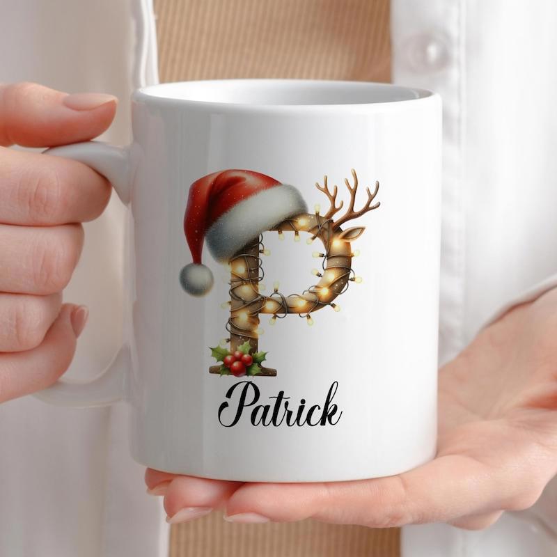 Tailorly White Ceramic 11 oz Mug - Patrick Festive Reindeer Design With Santa Hat And Twinkling Fairy Lights Initial