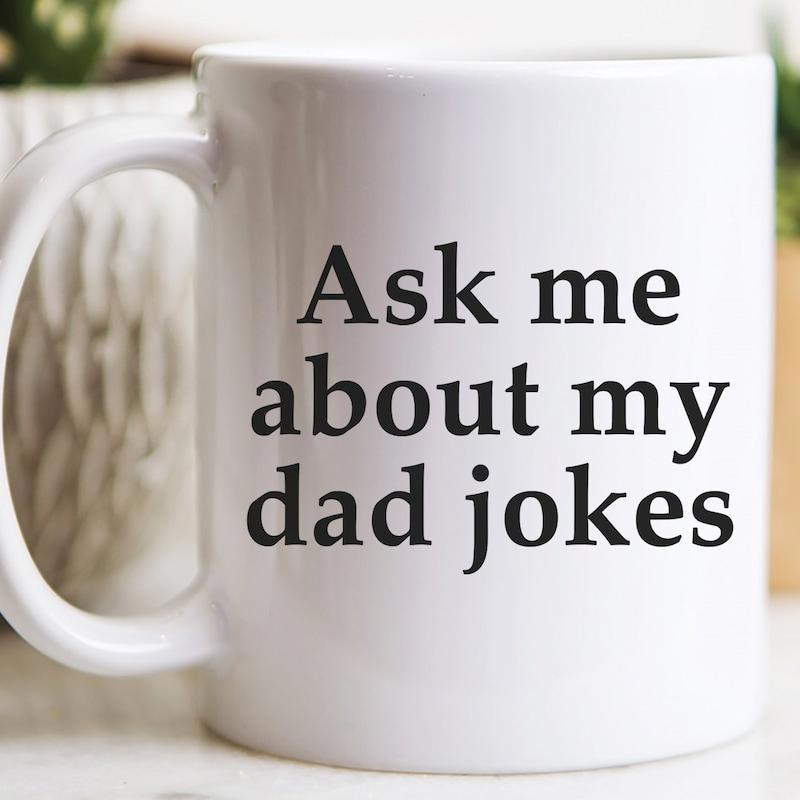 Tailorly White Ceramic 11 oz Mug - Ask Me About My Dad Jokes Minimalist Black Typographic Layout Printed Centrally On A Clean Surface Mug