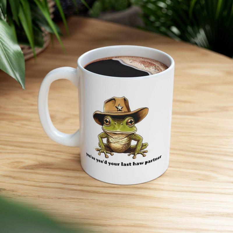 Tailorly White Ceramic 11 oz Mug - Youve Yeed Your Last Haw Partner Tiny Green Amphibian Wearing A Miniature Brown Western Cowboy Hat Frog