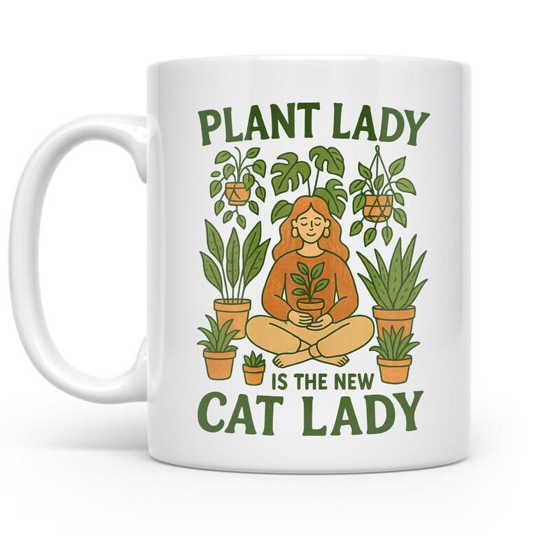 Tailorly White Ceramic 11 oz Mug - Plant Lady Is The New Cat Lady Sitting Peacefully Among Diverse Potted Green Houseplants In A Meditative State Woman