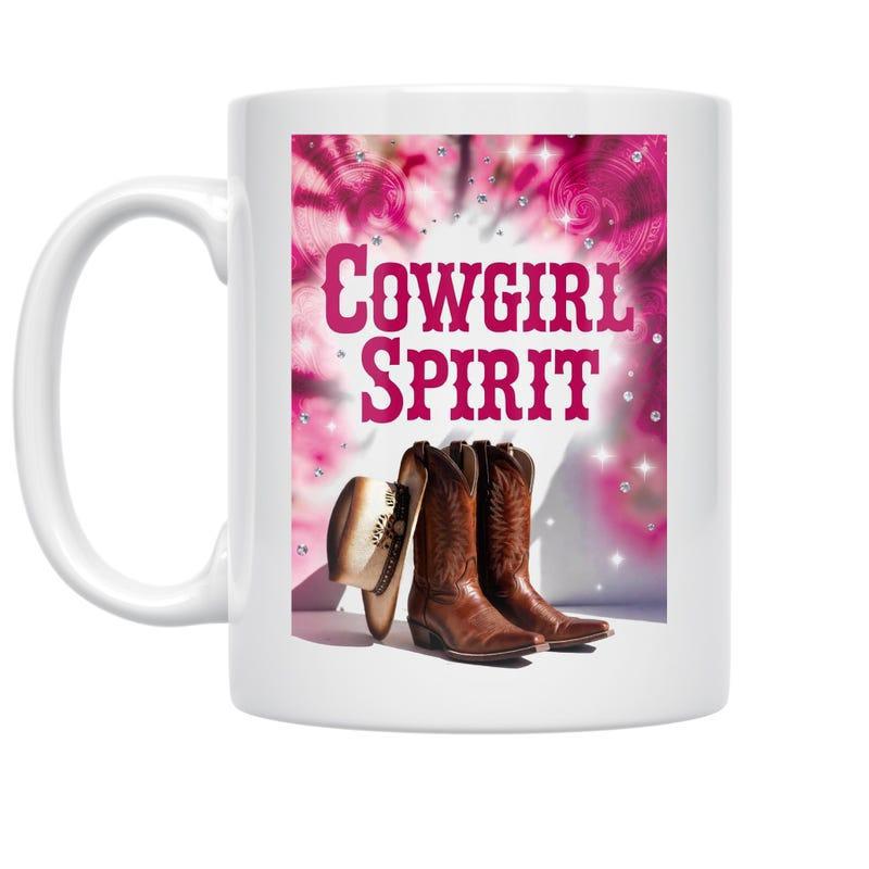 Tailorly White Ceramic 11 oz Mug - Cowgirl Spirit Rustic Leather Western Accessories Beside A Classic Cowboy Hat Boots