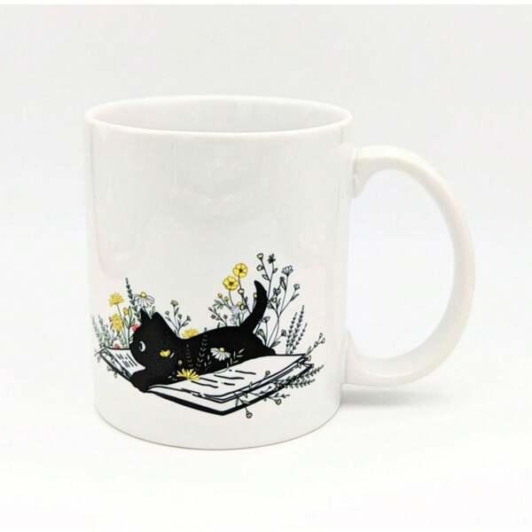 Tailorly White Ceramic 11 oz Mug - Charming Hand Drawn Black Cat Resting On Open Book Among Golden Wildflowers Cat