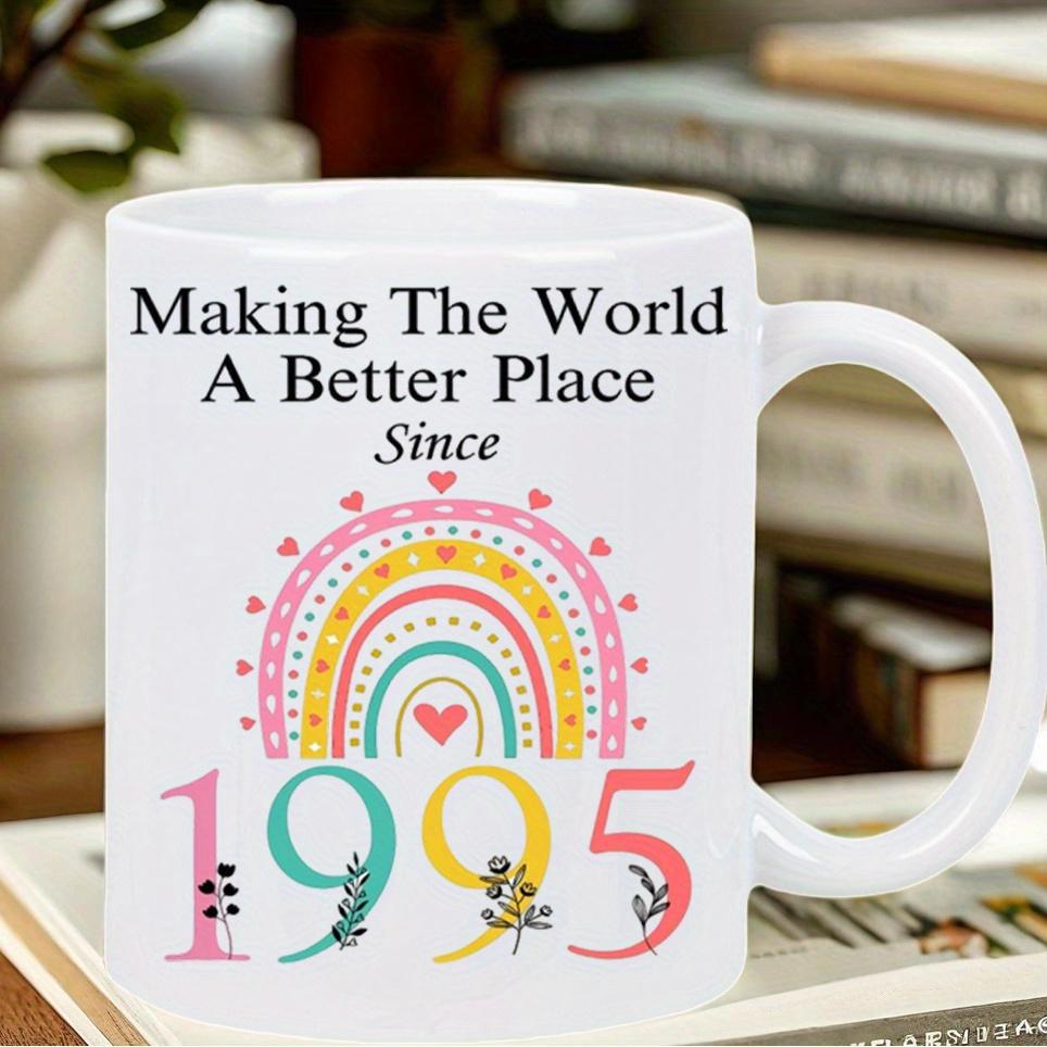 Tailorly White Ceramic 11 oz Mug - Making The World A Better Place Since 1995 Pastel Colored Hearts And Delicate Floral Patterns Under Floating Rainbow