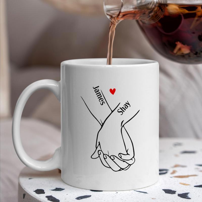 Tailorly White Ceramic 11 oz Mug - James Shay Minimalist Line Drawing Of Interlocking Lovers Hands With Small Red Heart Hand