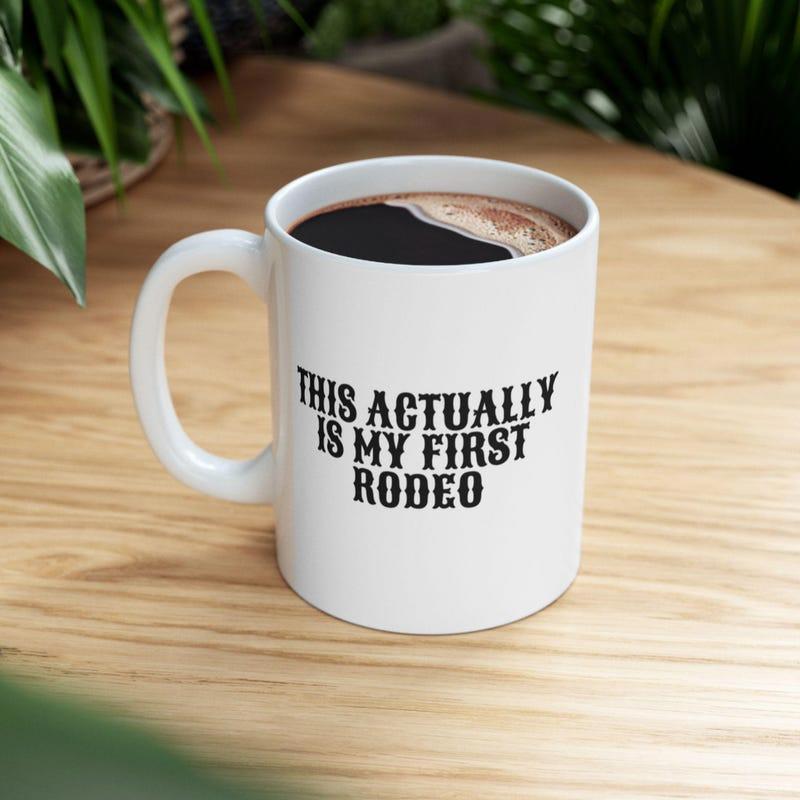 Tailorly White Ceramic 11 oz Mug - This Actually Is My First Rodeo Simple White Ceramic Vessel Filled With Hot Morning Coffee Mug