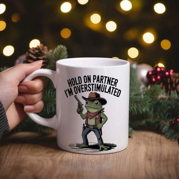 Tailorly White Ceramic 11 oz Mug - Hold On Partner Im Overstimulated Cartoon Green Amphibian Wearing Rustic Western Attire Holding Vintage Revolver Standing Firm