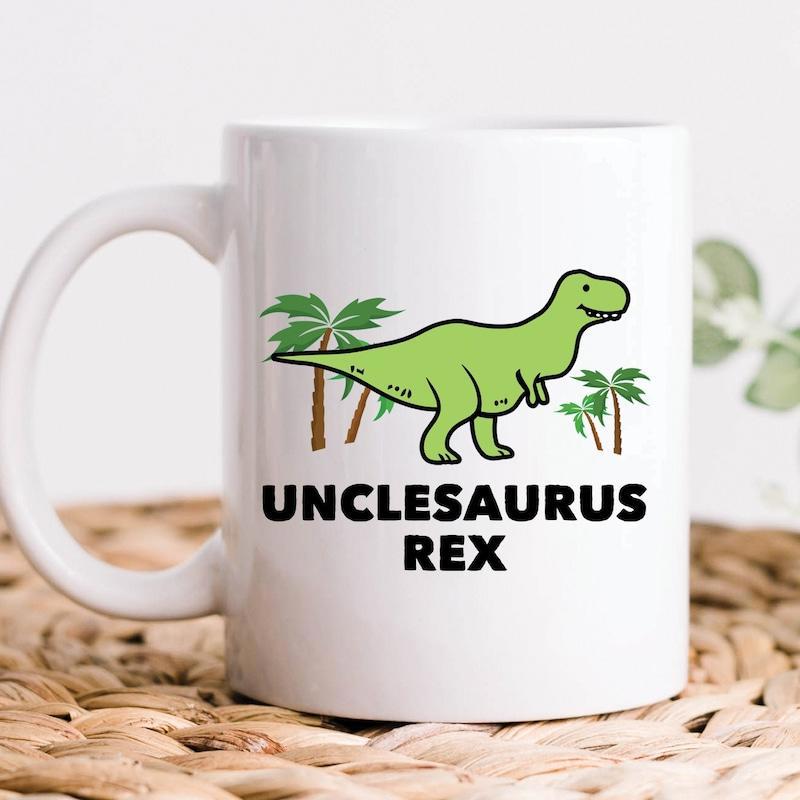 Tailorly White Ceramic 11 oz Mug - Unclesaurus Rex Smiling Green Cartoon Dinosaur Among Tropical Palm Trees Dinosaur